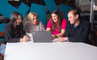 Noble events team at laptop