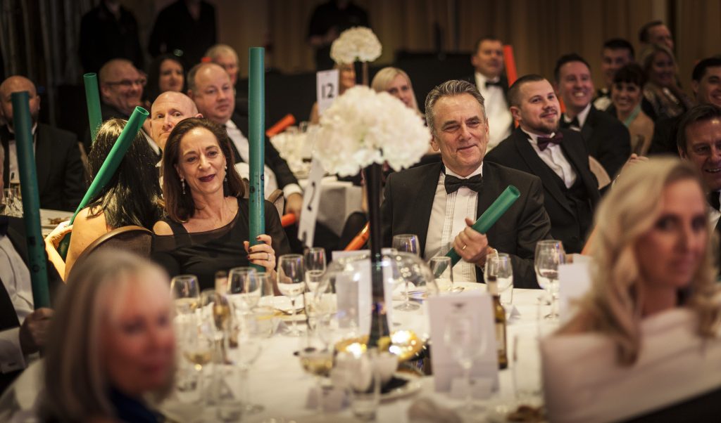 guests around luxury dining table event